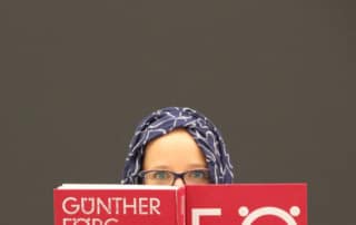 Woman in Hijab Reading